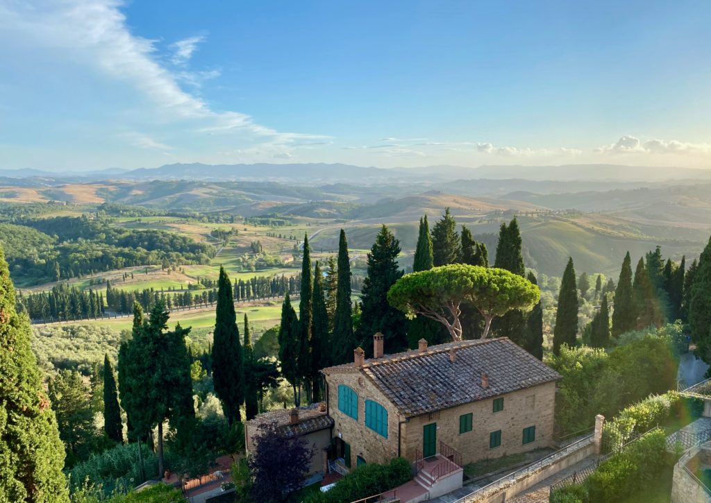 Tuscan valley with a tuscan house in the foreground